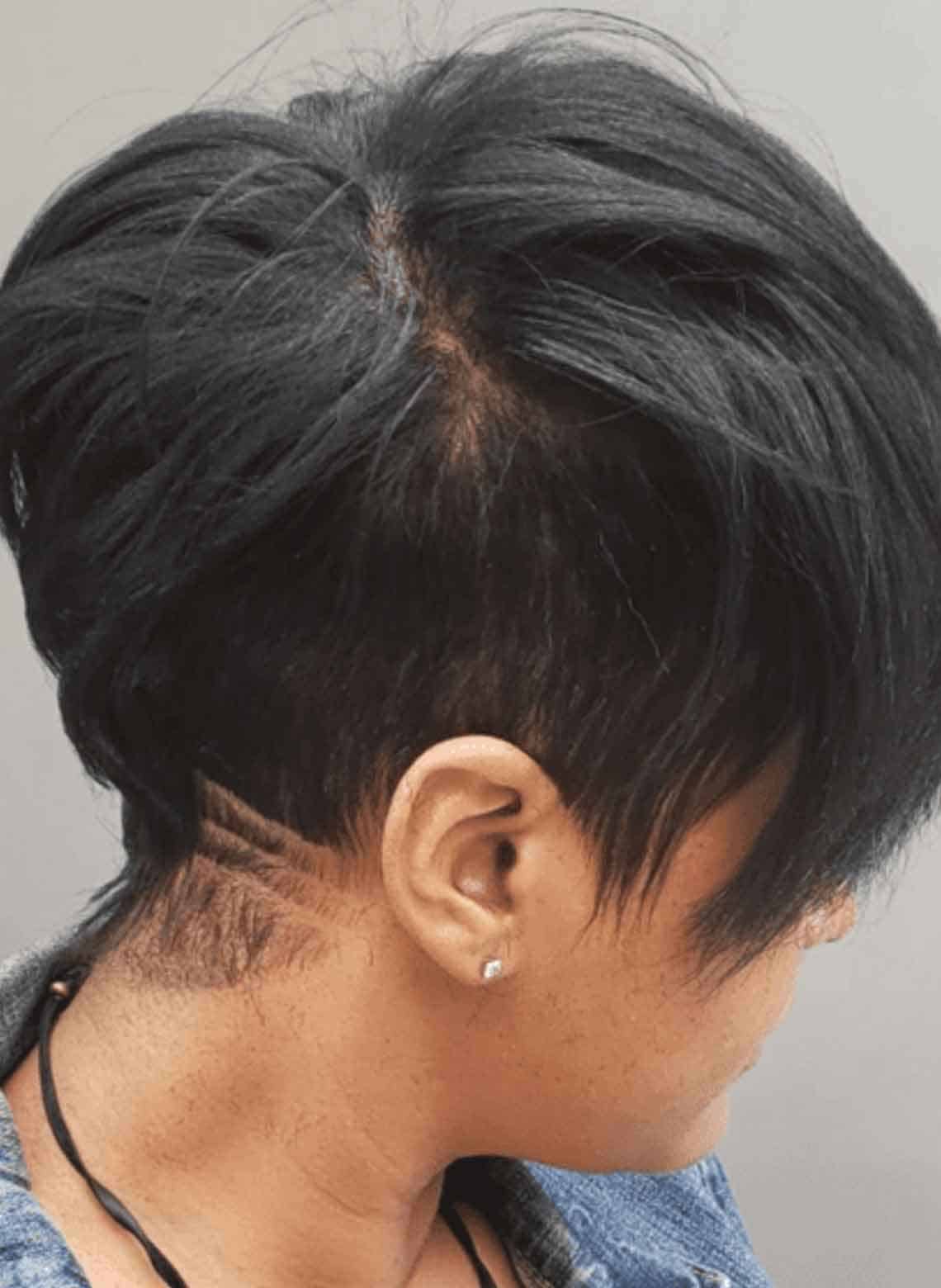 close up on person with short undercut with design on the nape of the neck