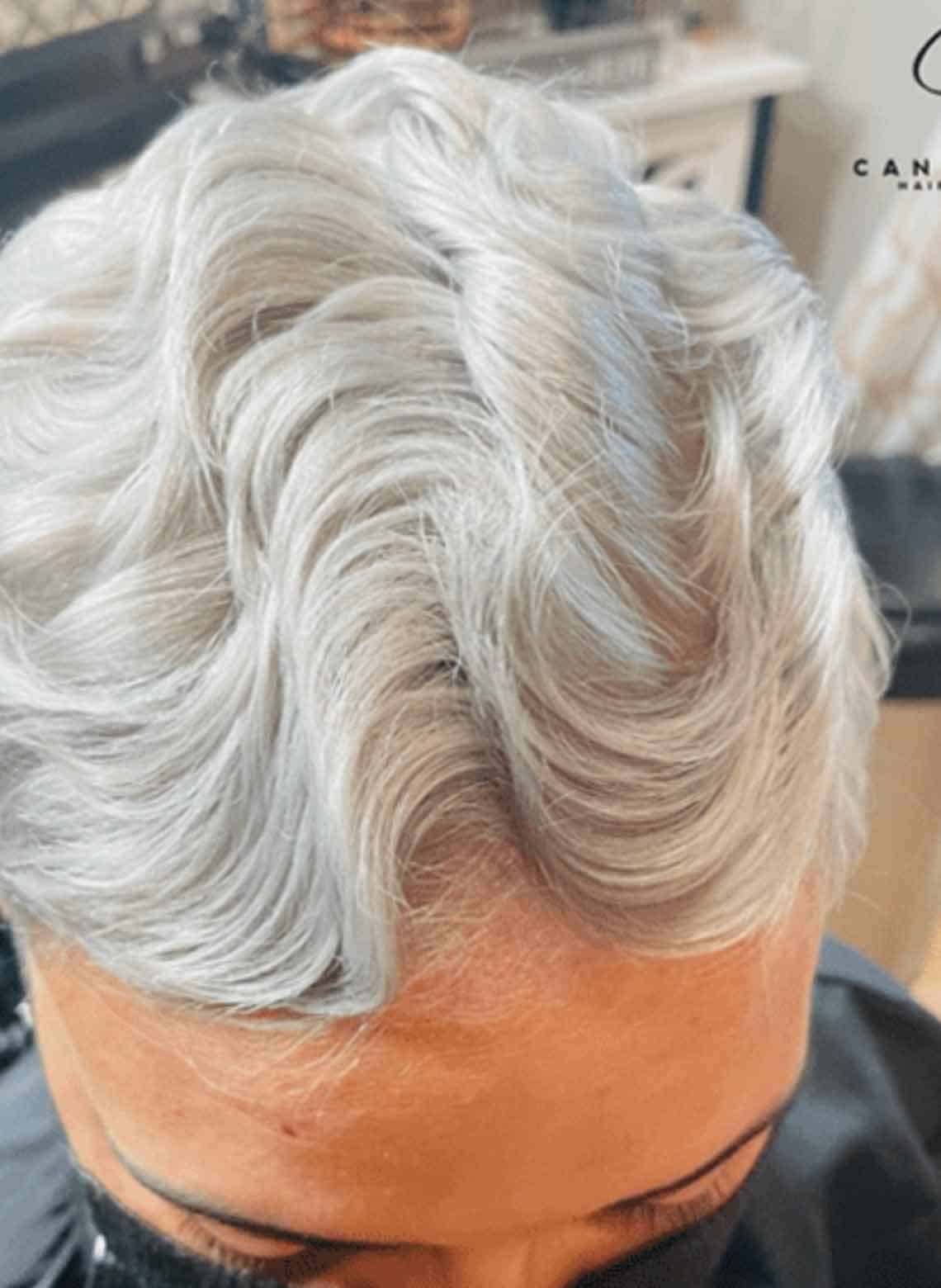 close up on top of person's head with silver finger waves