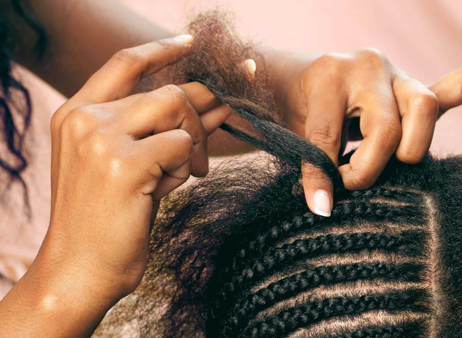 woman installing braids