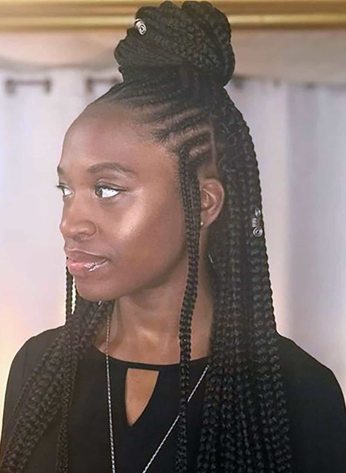 woman with braided half up half down top knot
