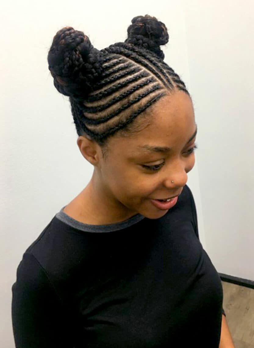 woman with braided spaces buns
