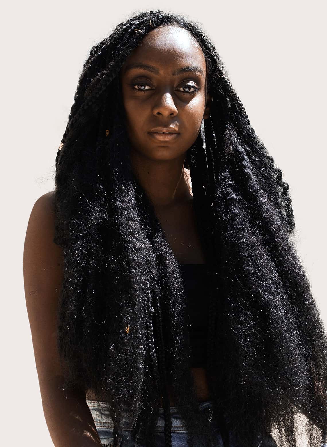 woman with long braids and textured ends