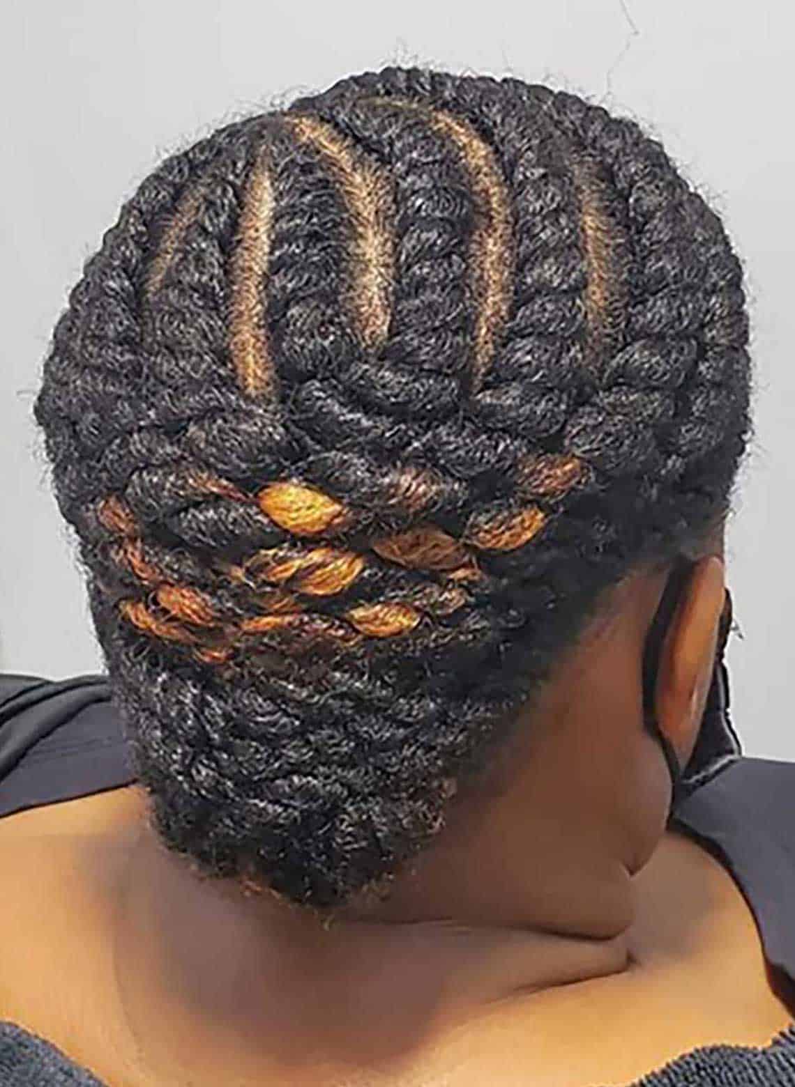 woman with chunky cornrows and low bun