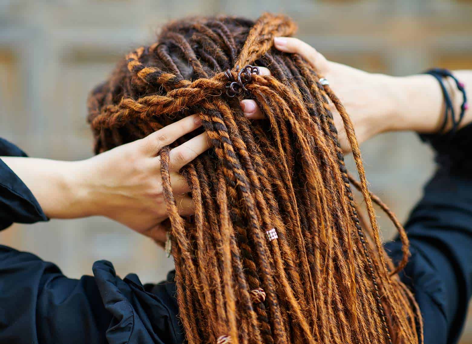 person with braided dreads