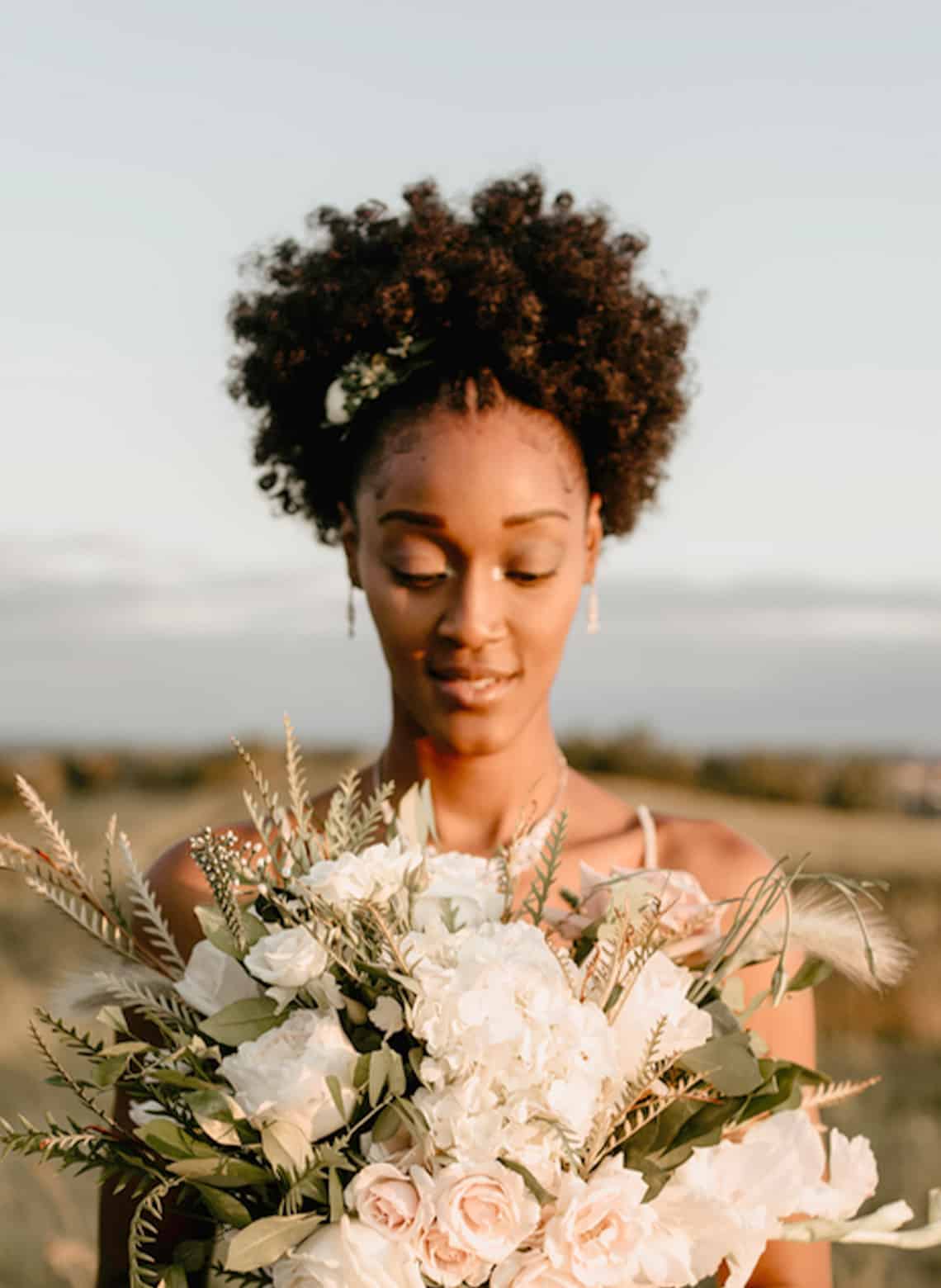 bride with cornrows and afro puff