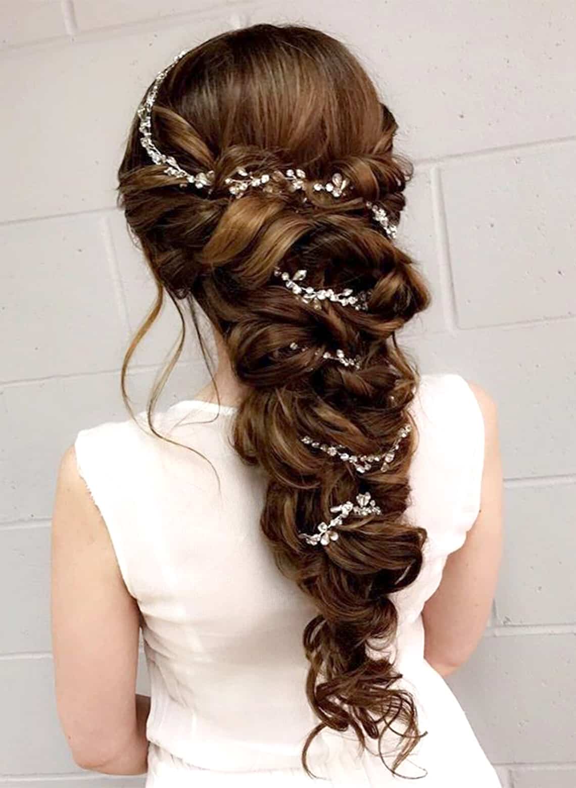 bride with curly braid and jewels
