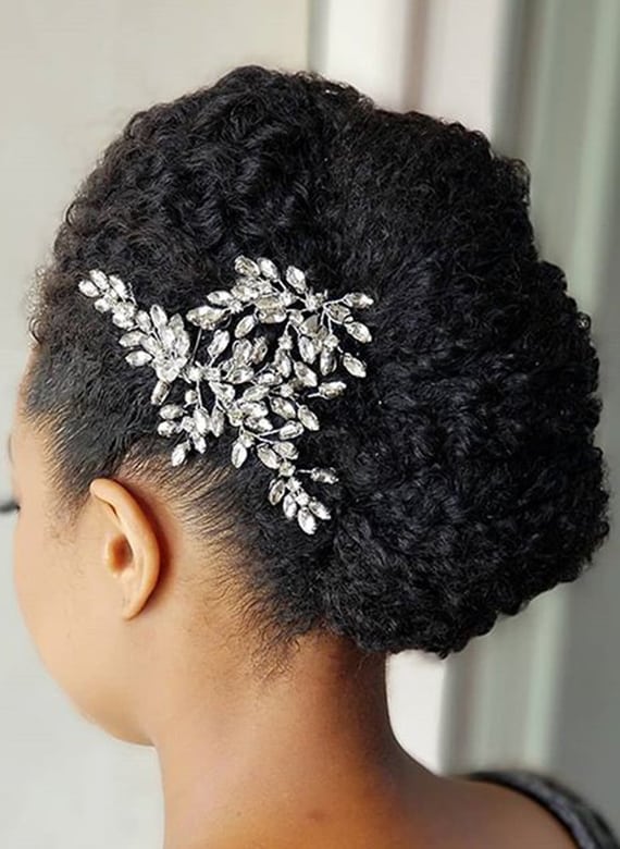 woman with curly updo and jewels