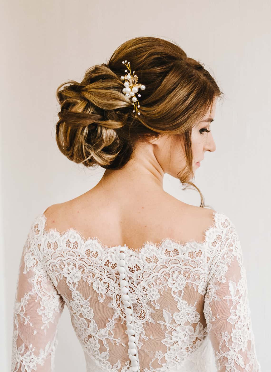 bride with curly updo and hair pin
