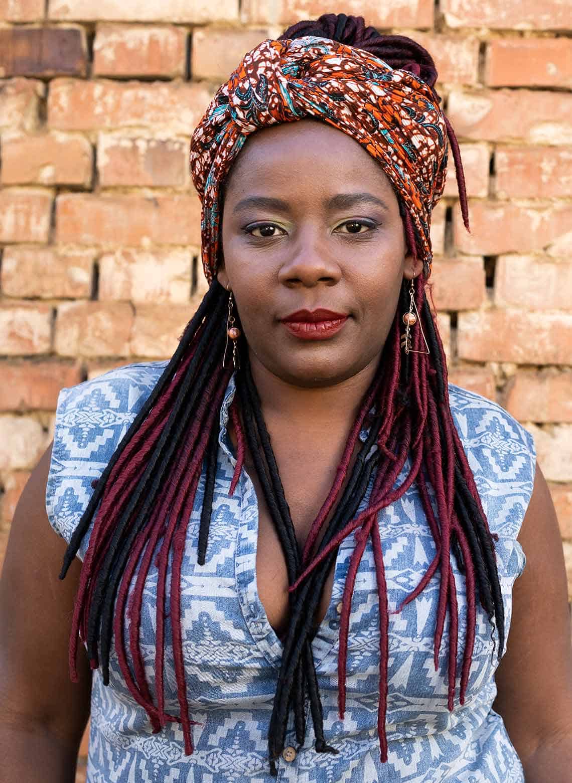woman with dreads and headscarf