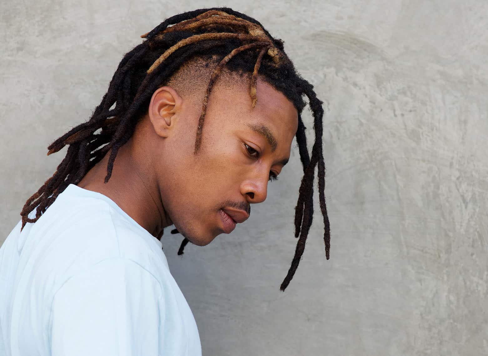 man with dreads and undercut