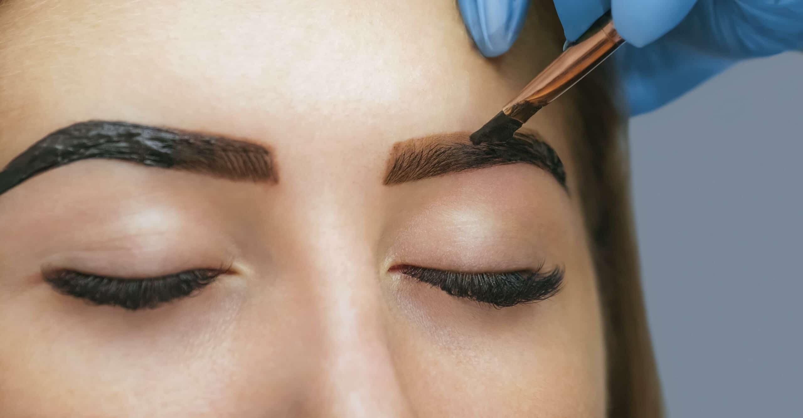 woman getting eyebrows tinted