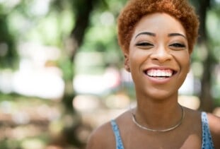 smiling woman with natural hair