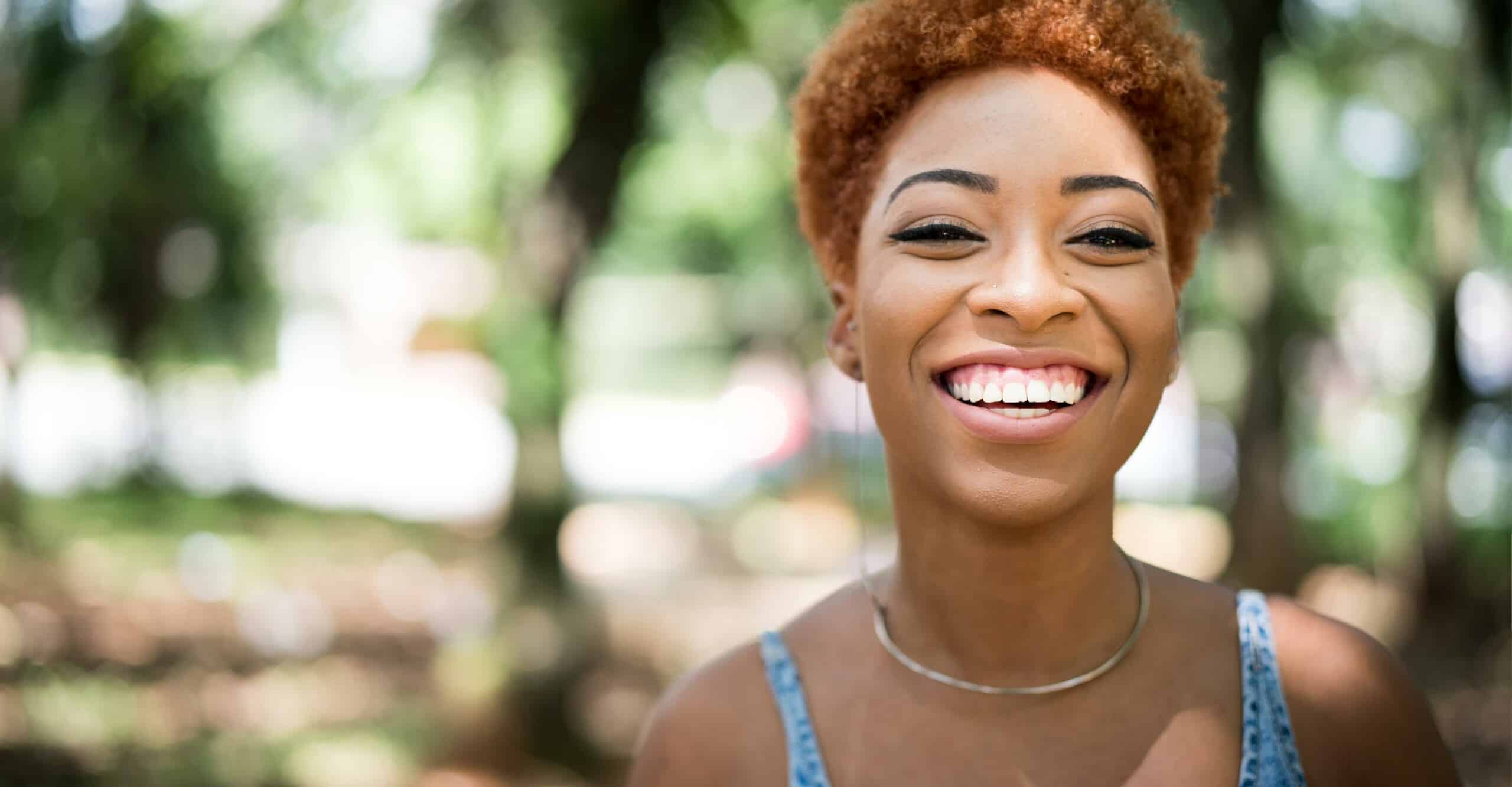 smiling woman with natural hair