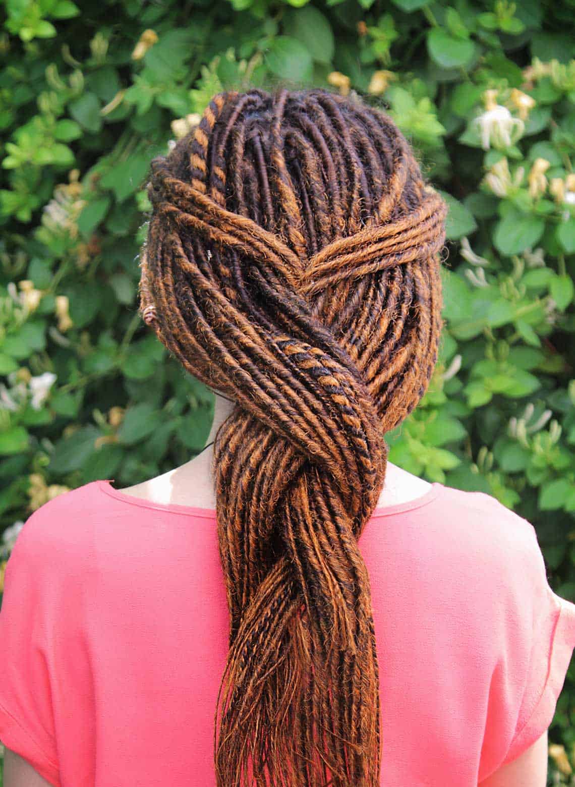 person with twisted braid locs