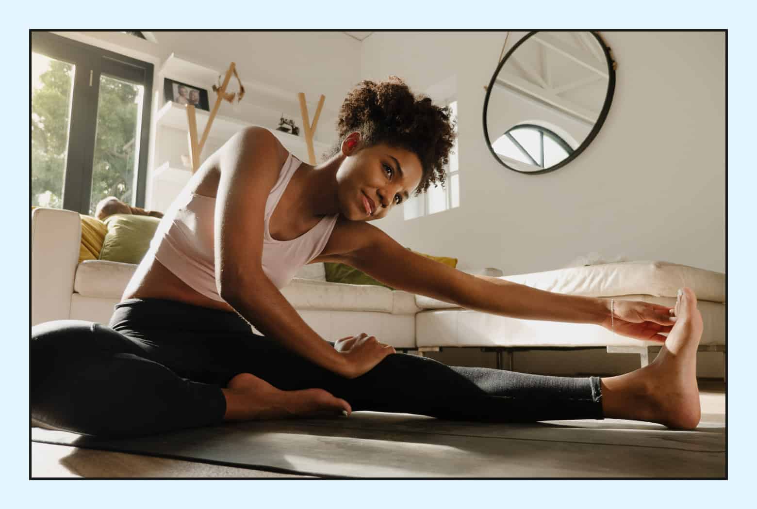 woman stretching in living room