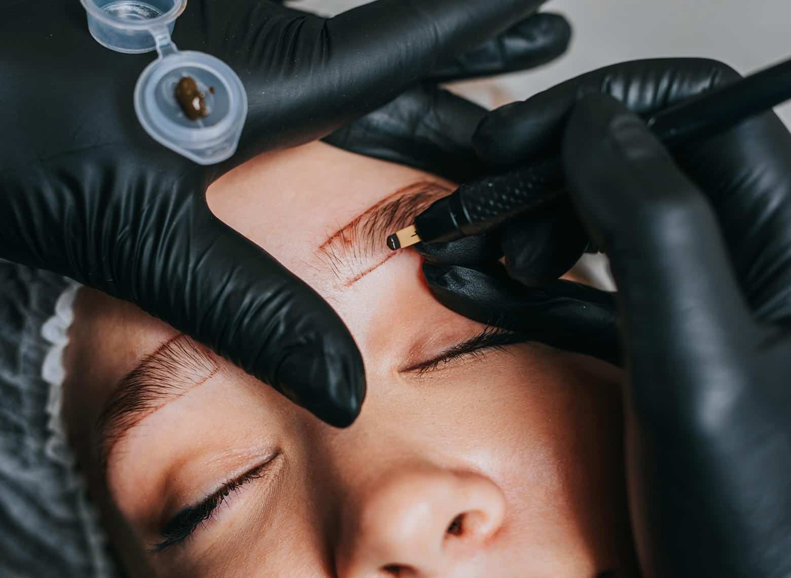 person getting brows done
