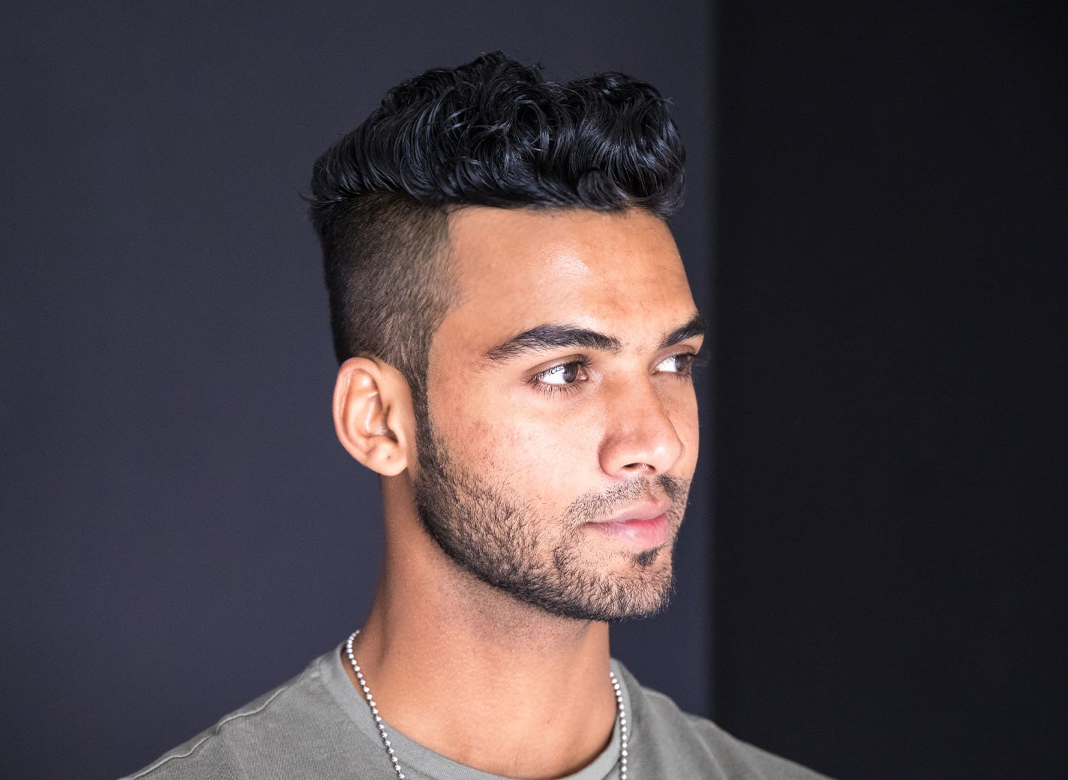 man with curly pompadour