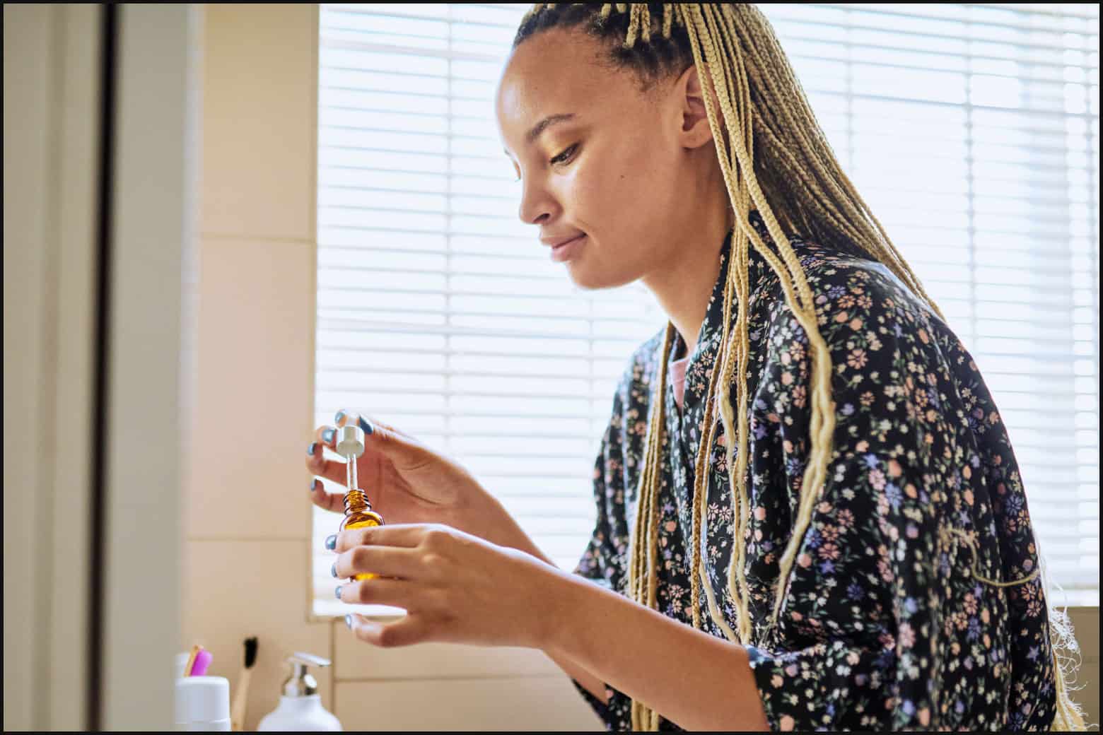 woman prepping hair oil