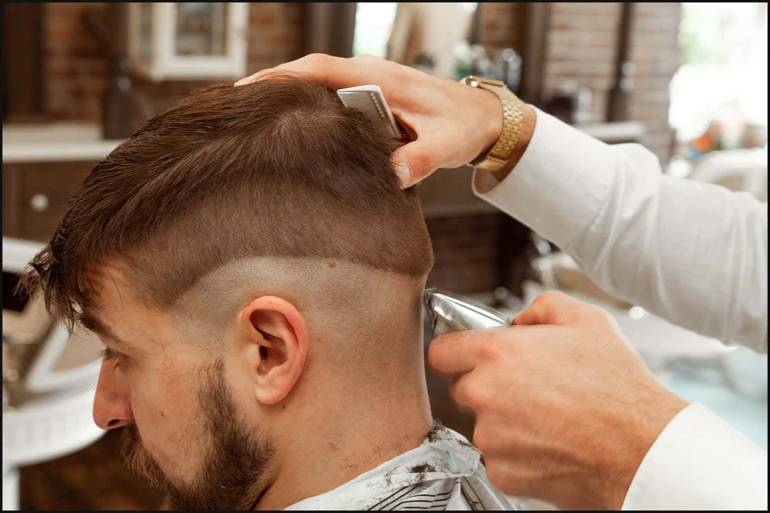 man getting haircut at the barber shop