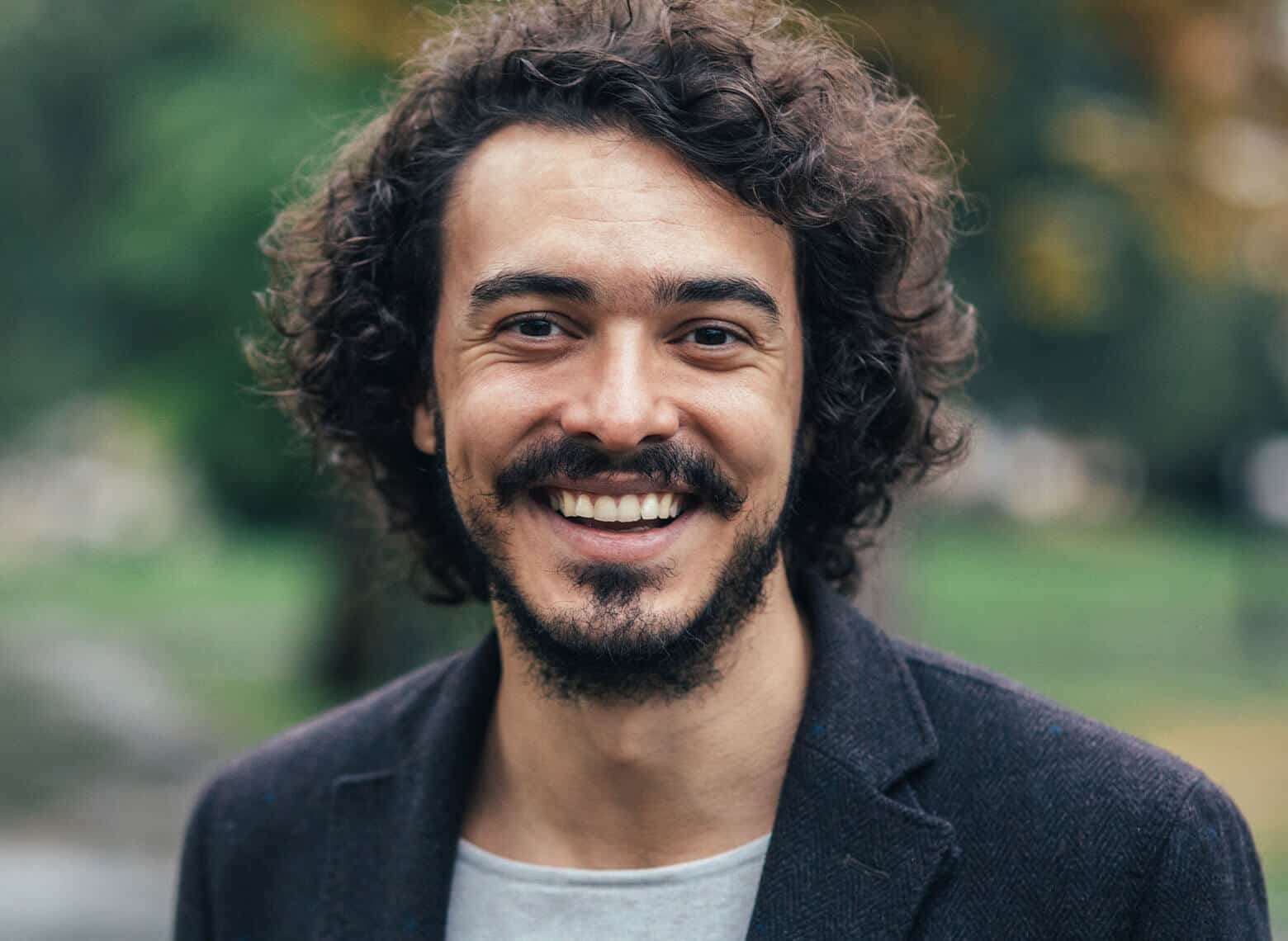 man with loose curls