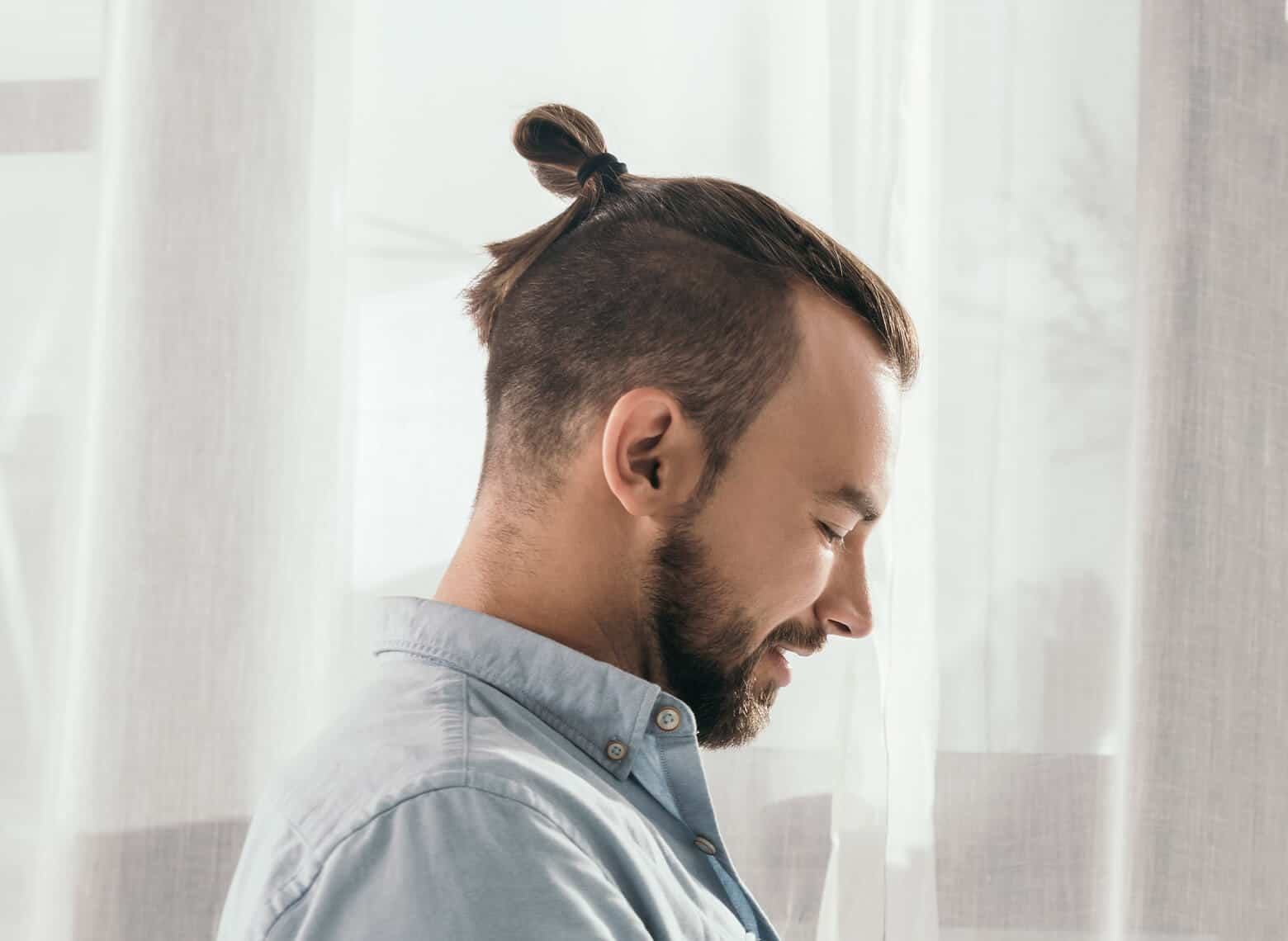 man with top knot