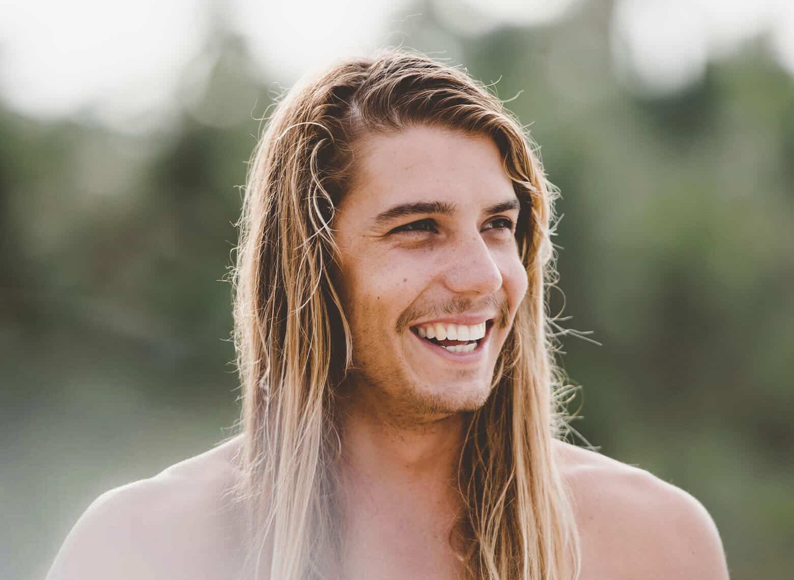 man with surfer hair
