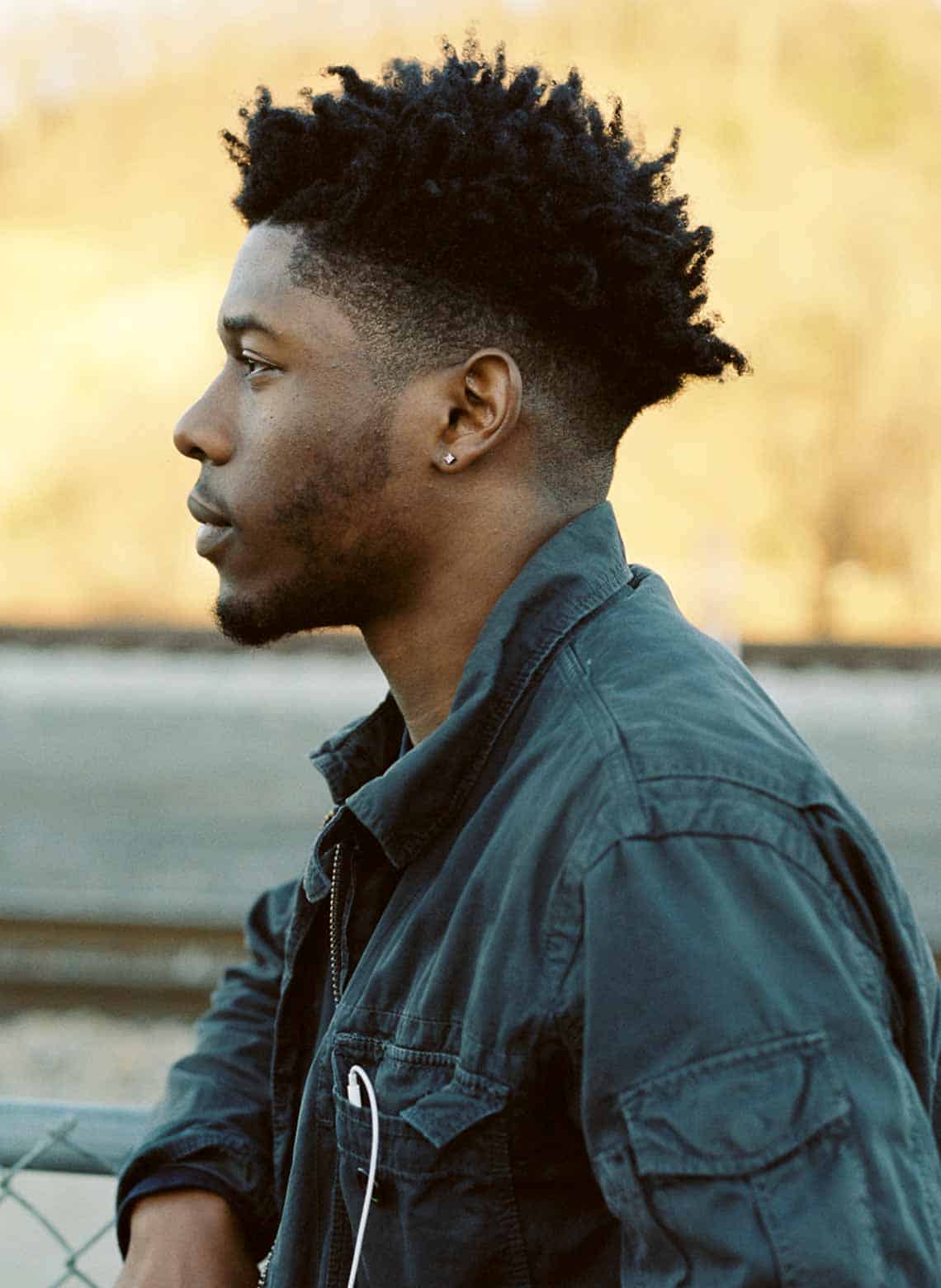 man with mid fade and twist out