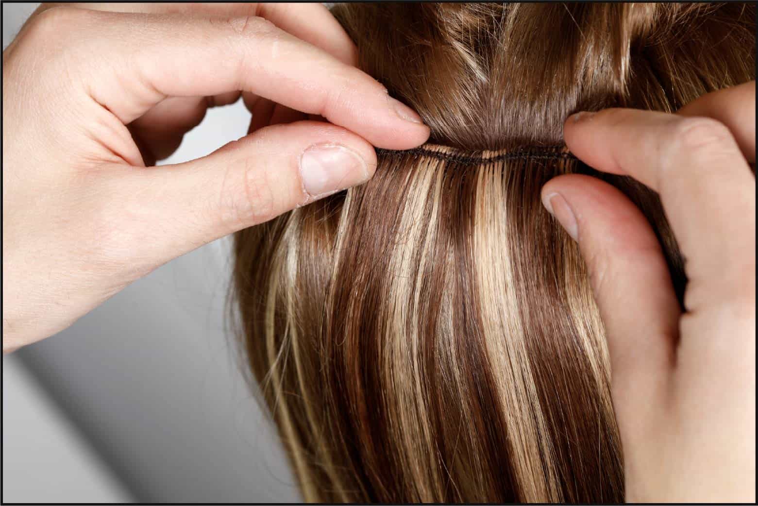 person applying hair extensions