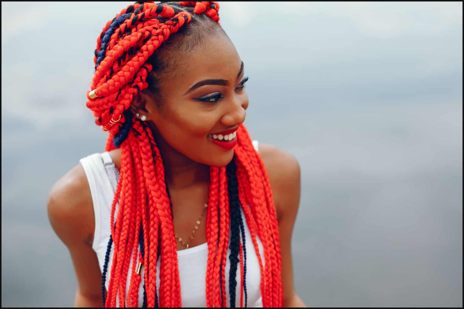 woman with bright red box braids