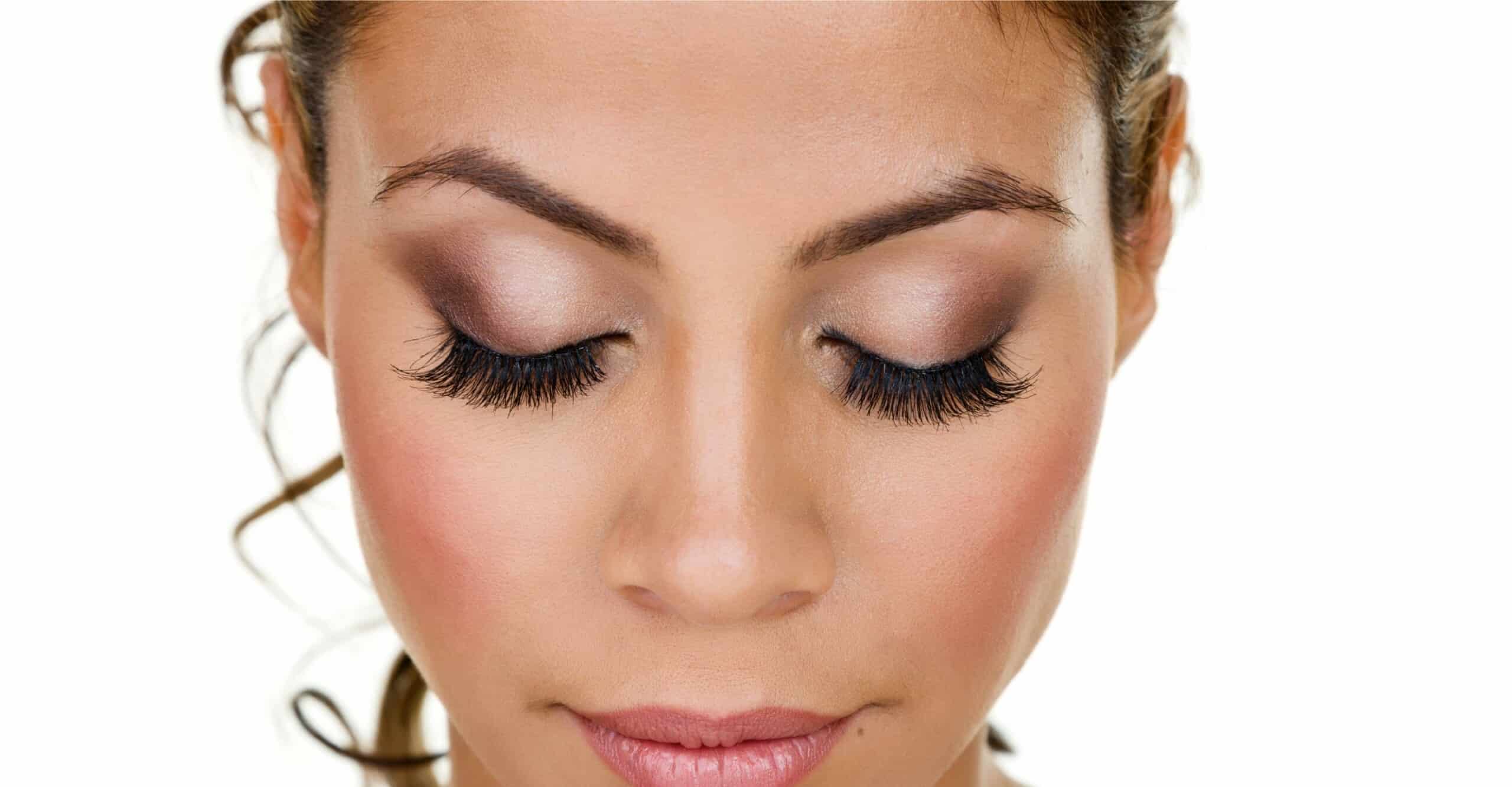 person with closed eyes and long lash extensions