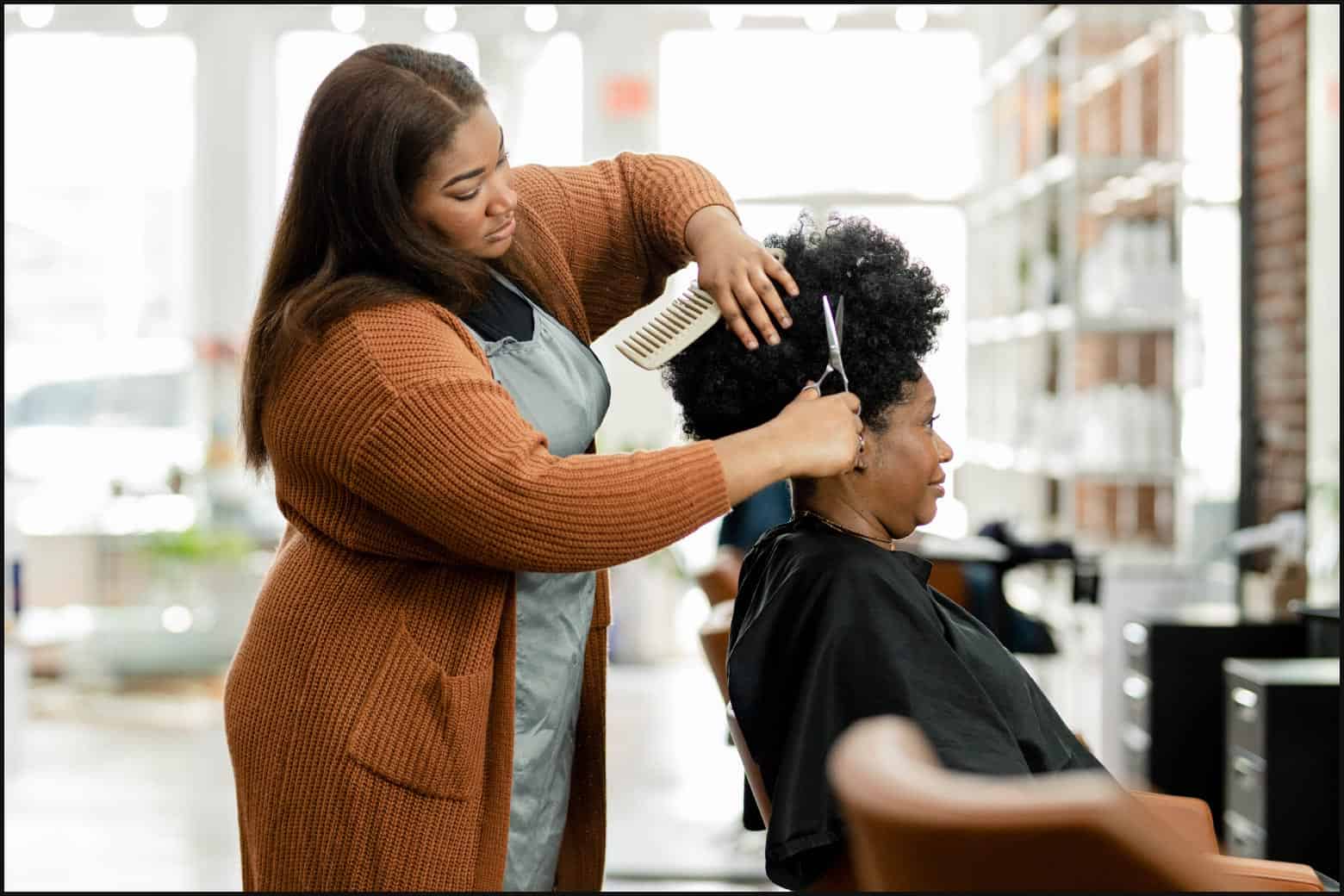 woman cutting hair in a salon