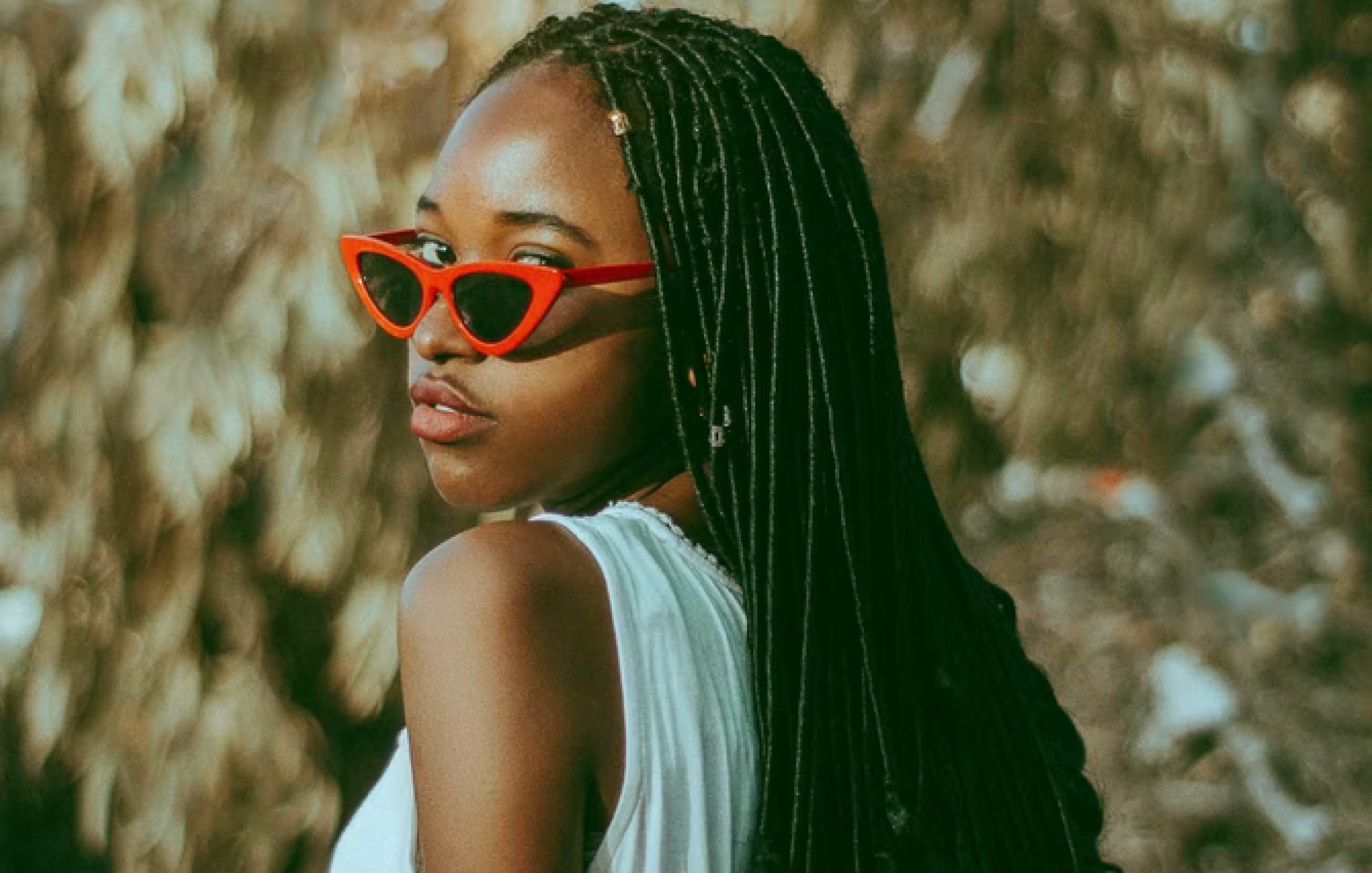 photo of woman with locs and sunglasses