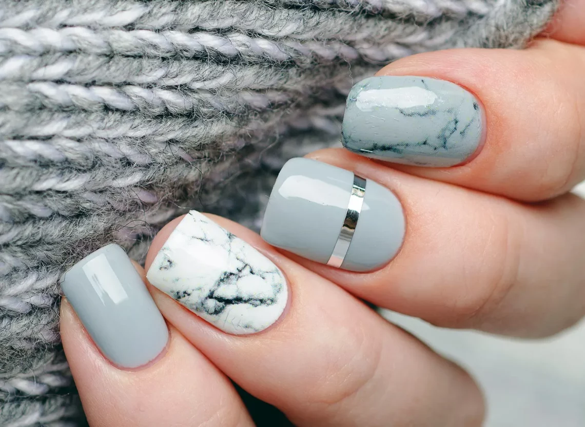  a set of gray shellac manicure nails