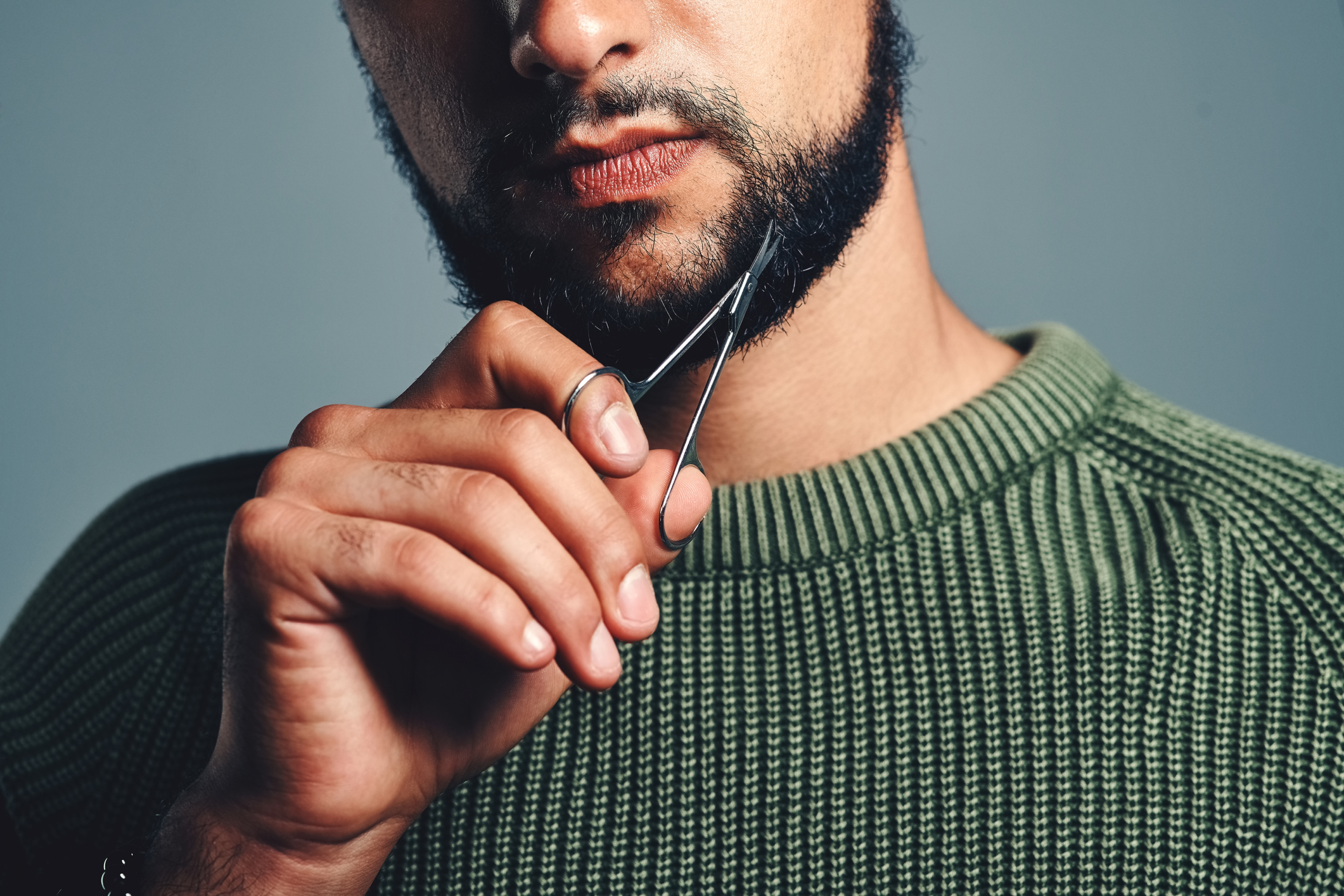 man cutting beard