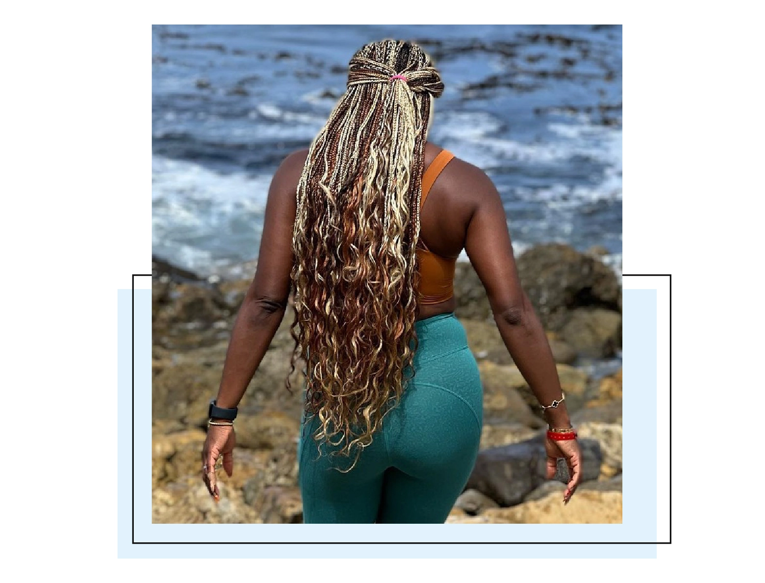 Woman with microbraids that have blonde and light brown braids integrated for highlights.
