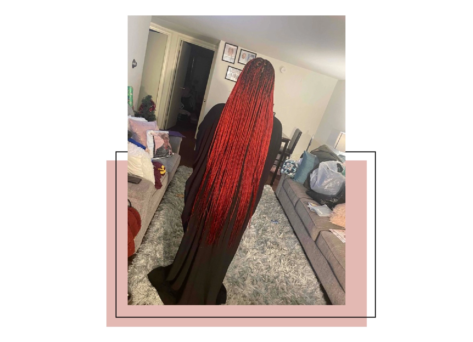 Woman with super long microbraids that are long enough to reach her legs.