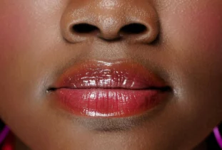 Close up of woman with lip blush.
