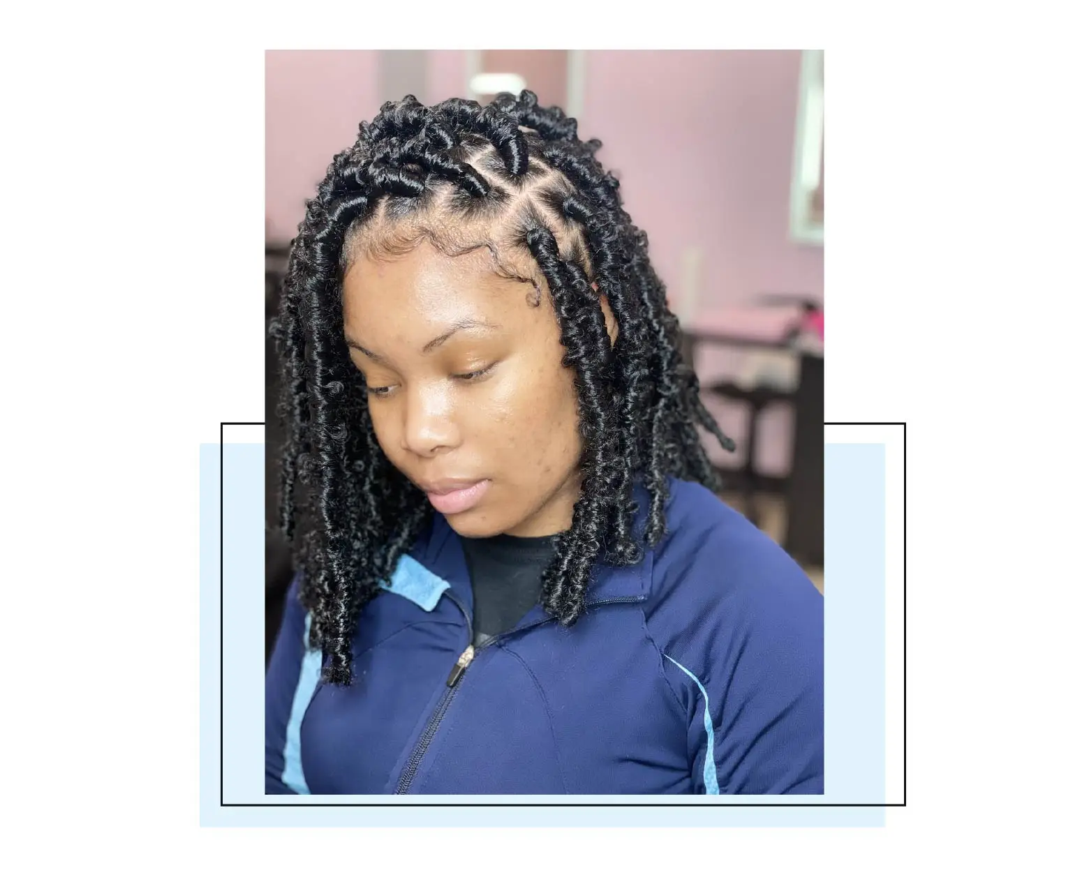 Woman with soft locs and laid edges.