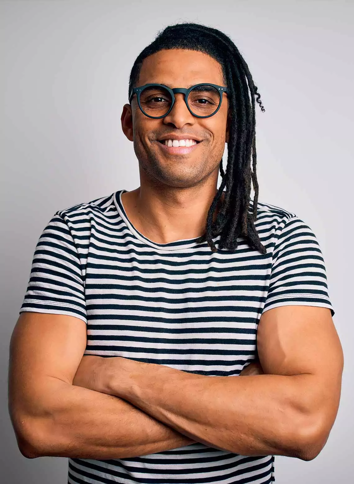 Image of man with side-swept locs.