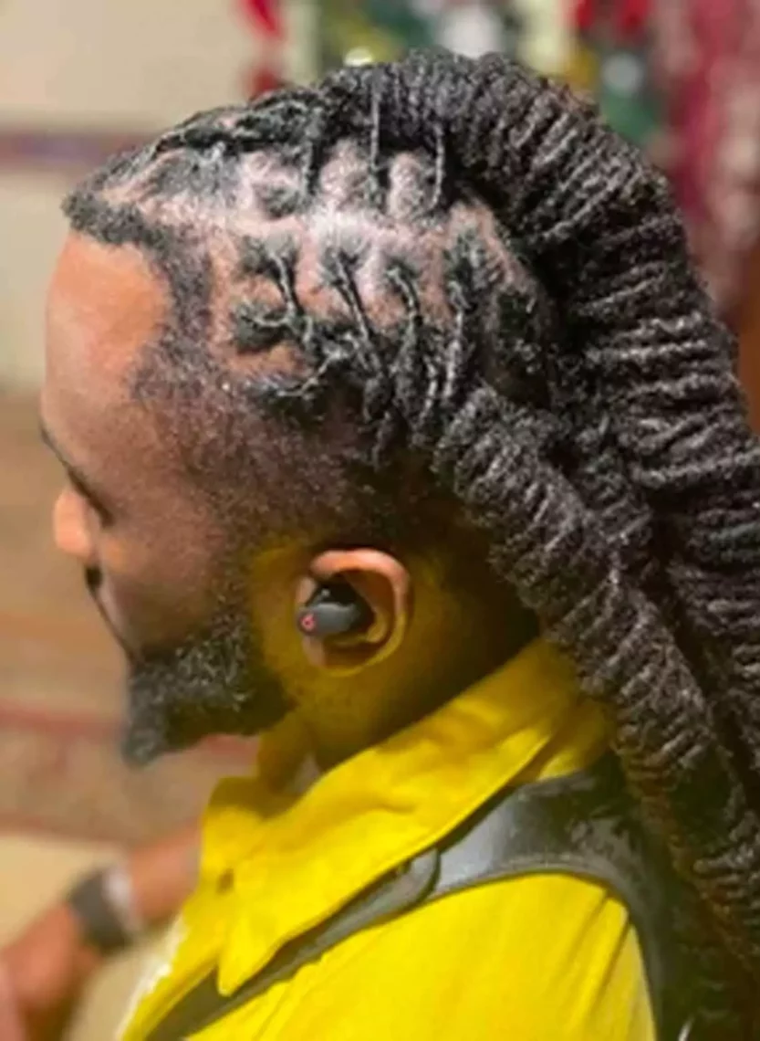 Image of man with knotted dreadlocks. 