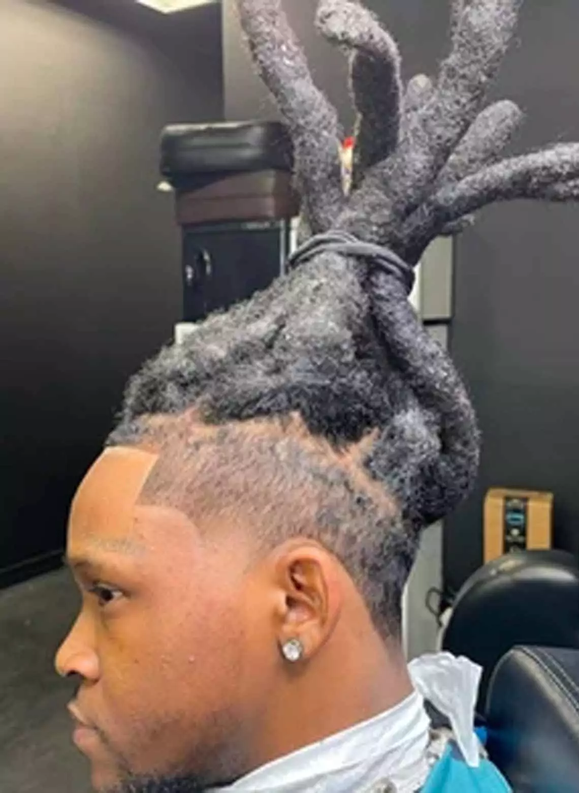 Image of man with wick locs.