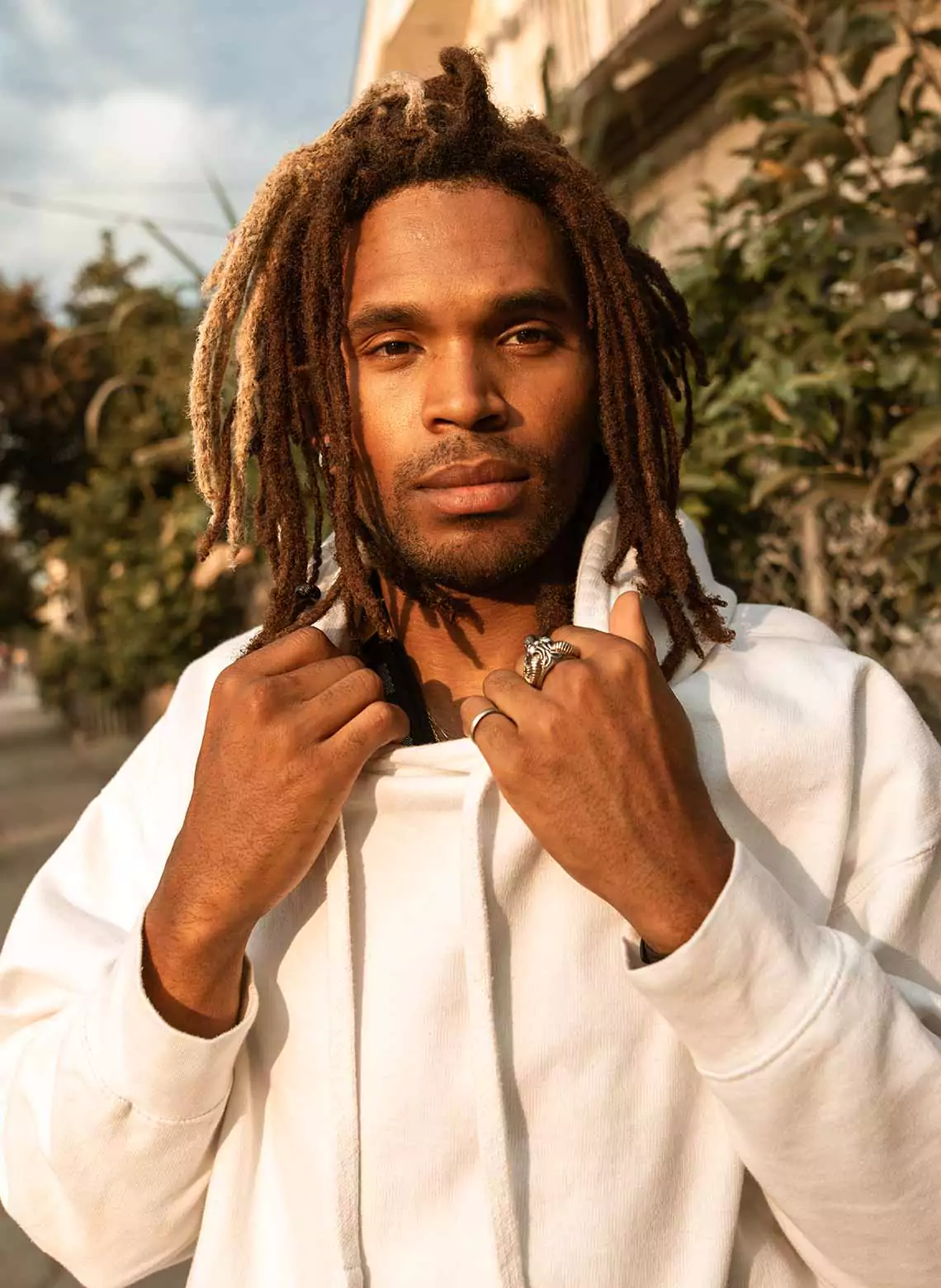 Image of man with layered locs