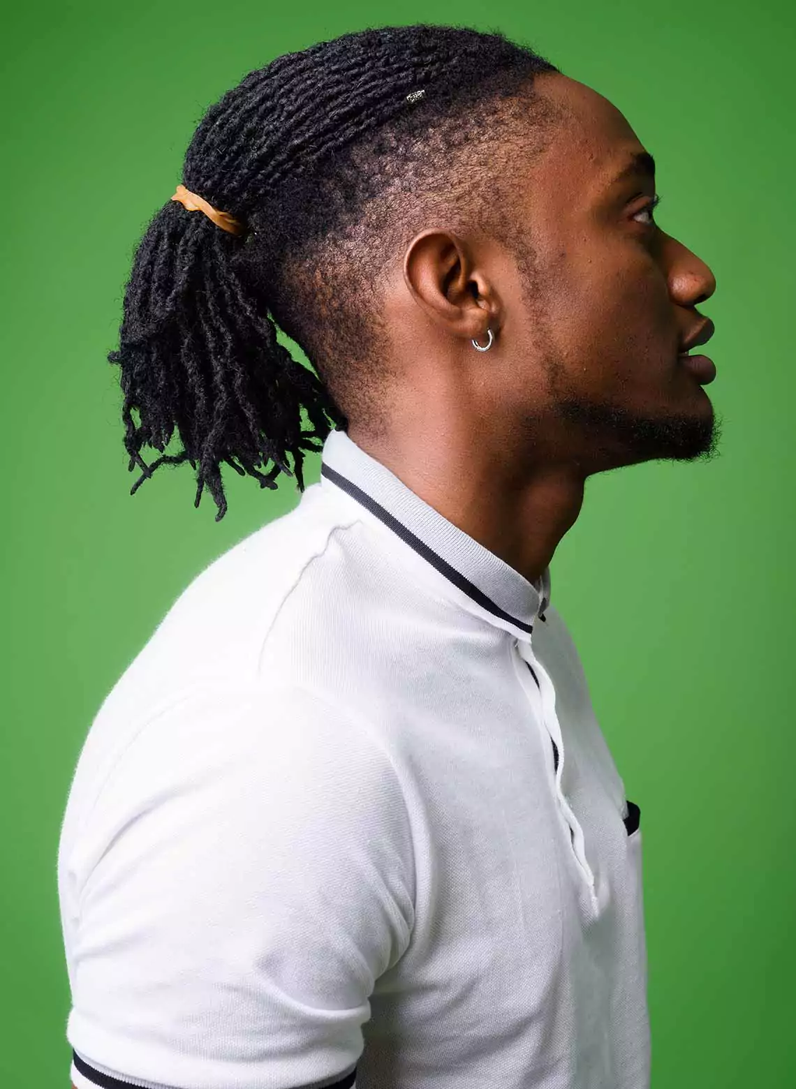 Image of man with locs and a undershave.